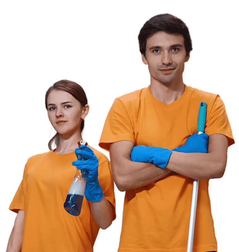 Zespół pracowników firmy sprzątającej w pomarańczowych uniformach